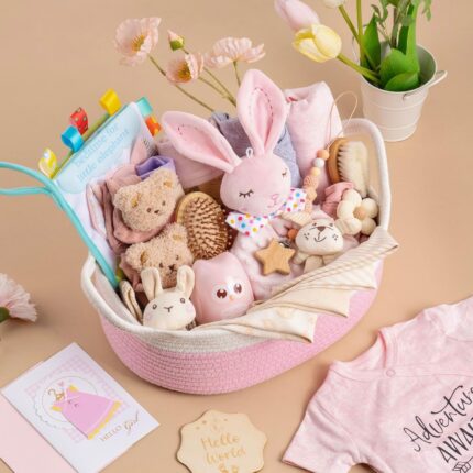 A luxurious 30-piece pink baby gift basket by Glowsprout, filled with newborn essentials and keepsakes.
