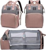 Pink houscly diaper bag backpack with changing station, open to show compartments and accessories.