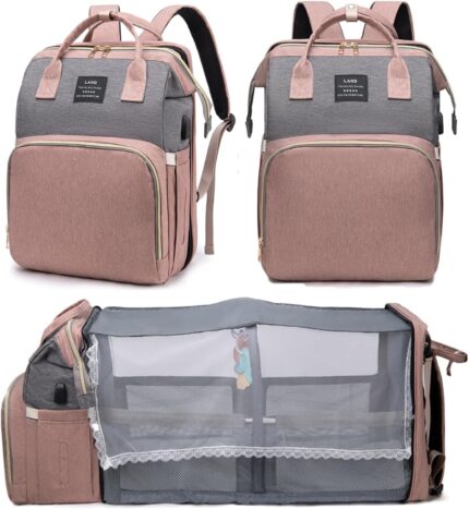 Pink houscly diaper bag backpack with changing station, open to show compartments and accessories.