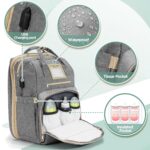 Light grey Lenski diaper bag backpack with a front pocket, showing its spacious design and modern features.