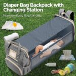 Light grey Lenski diaper bag backpack with a front pocket, showing its spacious design and modern features.