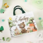 A close-up of the Loveinside "Oh Baby" reusable gift bag featuring woodland animals like bears, foxes, deer, and rabbits.