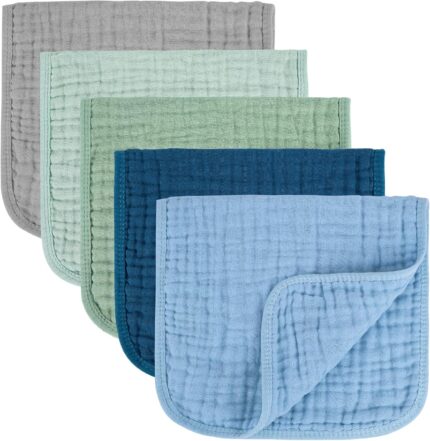 Five MIGIOL muslin burp cloths in shades of blue and green, folded neatly on a light background.