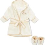 Close-up of a brown Spasilk 100% cotton hooded terry bathrobe with a cartoon pattern and matching booties.