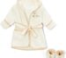 Close-up of a brown Spasilk 100% cotton hooded terry bathrobe with a cartoon pattern and matching booties.