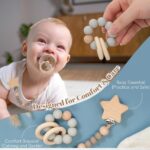 A 9-piece baby boy gift set including a teddy bear outfit, plush bear, pacifier clip, blue bib, and cotton basket.