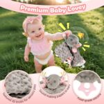 Pink baby girl gift set with swaddle blanket, bunny rattle, elephant lovey, headband, socks, bib, and birth sign in a gift bo