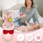 Pink baby girl gift set with swaddle blanket, bunny rattle, elephant lovey, headband, socks, bib, and birth sign in a gift bo