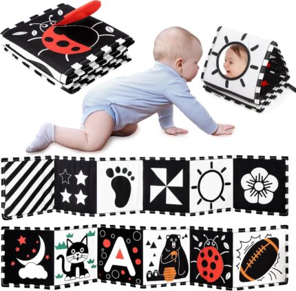 A black and white high contrast baby soft book with a mirror, featuring various patterns like stars and floral designs.