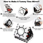 A black and white high contrast baby soft book with a mirror, featuring various patterns like stars and floral designs.