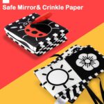 A black and white high contrast baby soft book with a mirror, featuring various patterns like stars and floral designs.