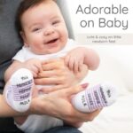 Seven pairs of ZIRI & ZANE baby socks in various multi-color, animal print, letter print, and striped patterns.